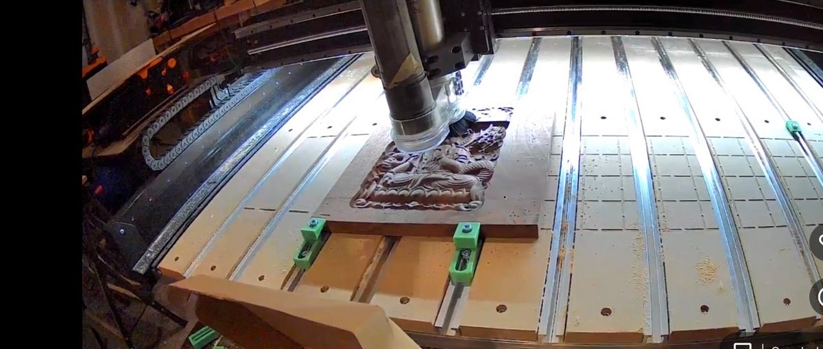 Black walnut relief carving in progress on the CNC router