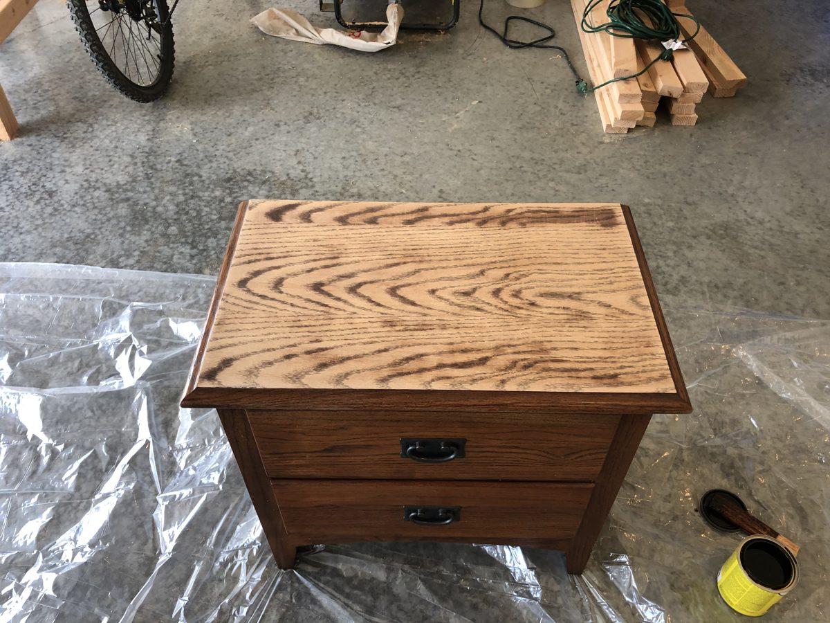 Oak nightstand top mid-refinish, grain showing through