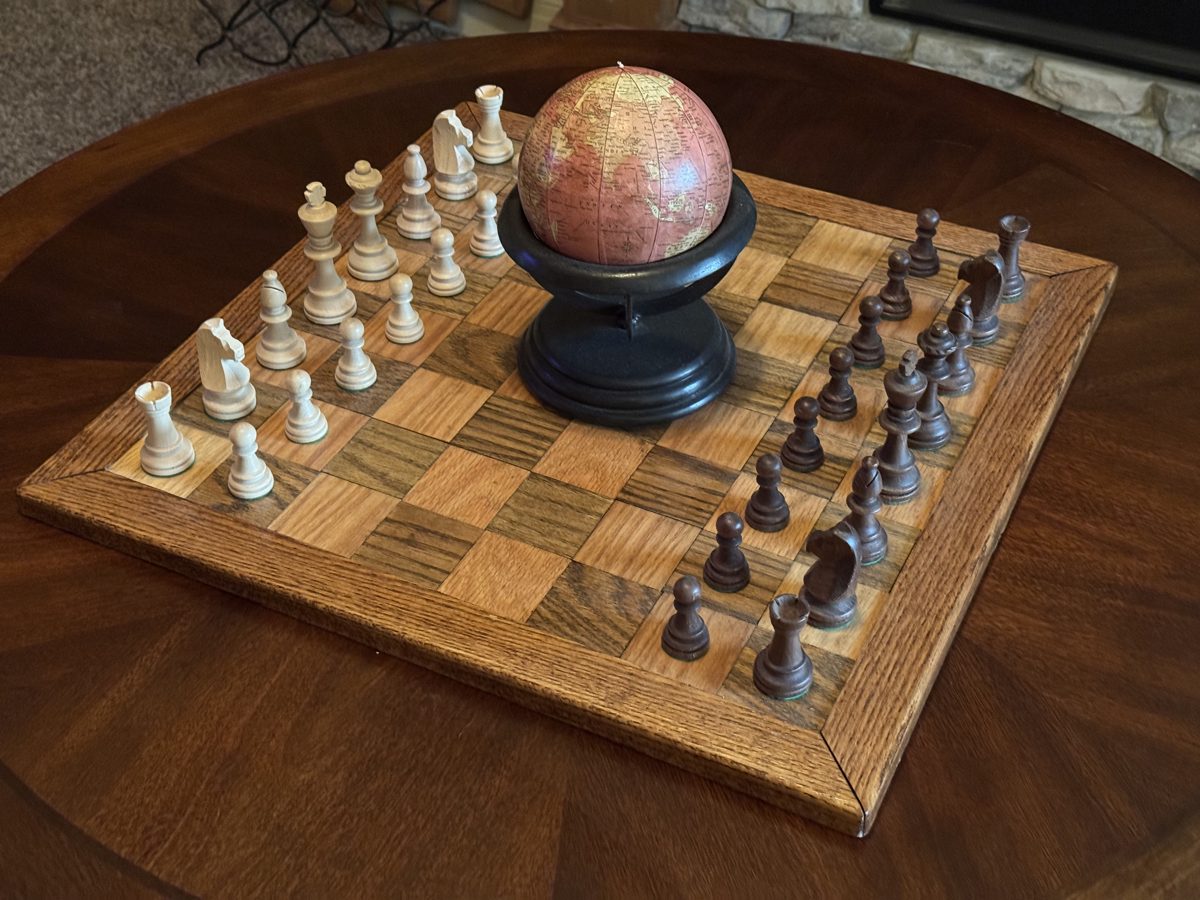 Finished oak chessboard set up for play