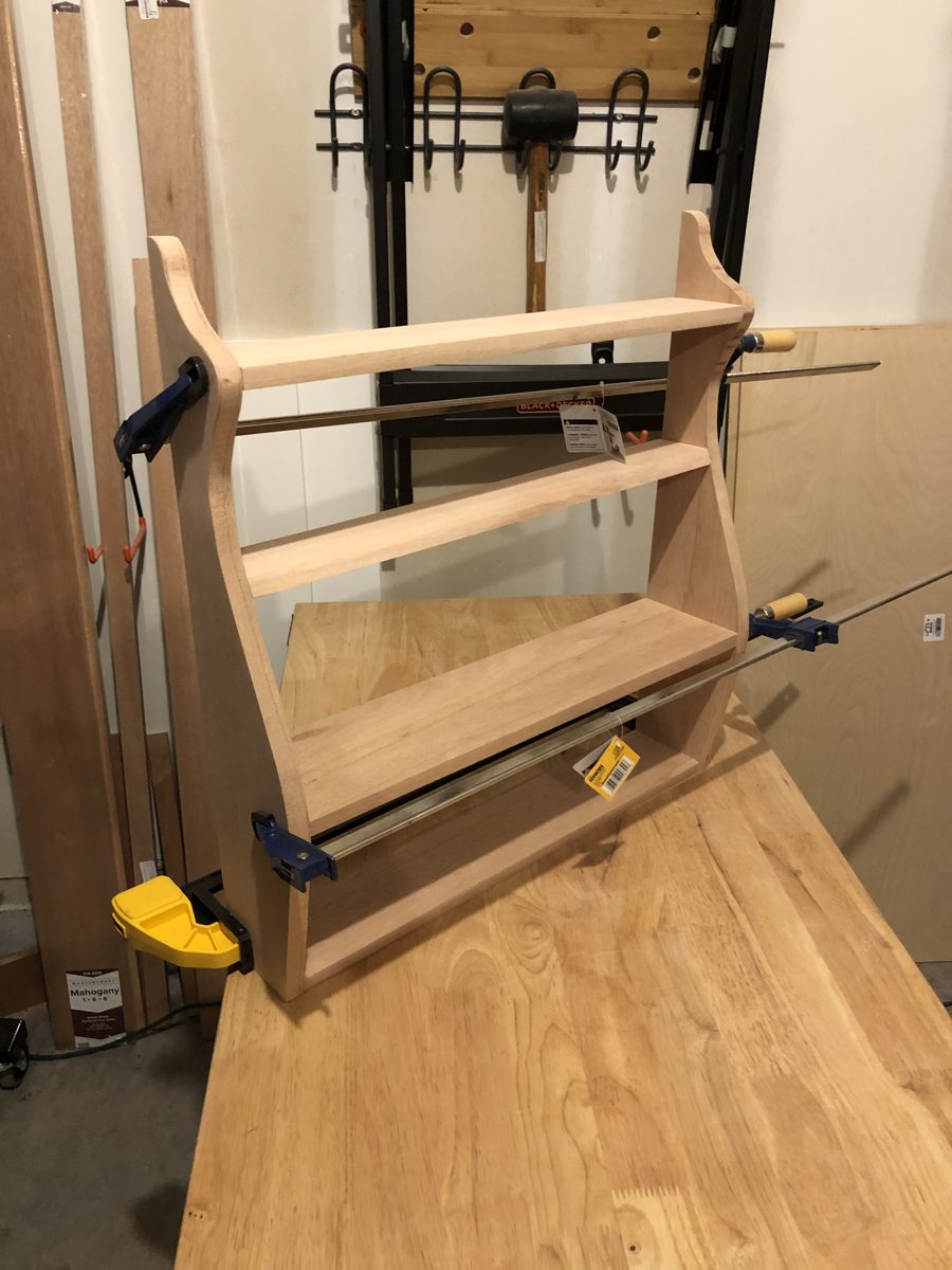 Whale-tail shelf in clamps during glue-up
